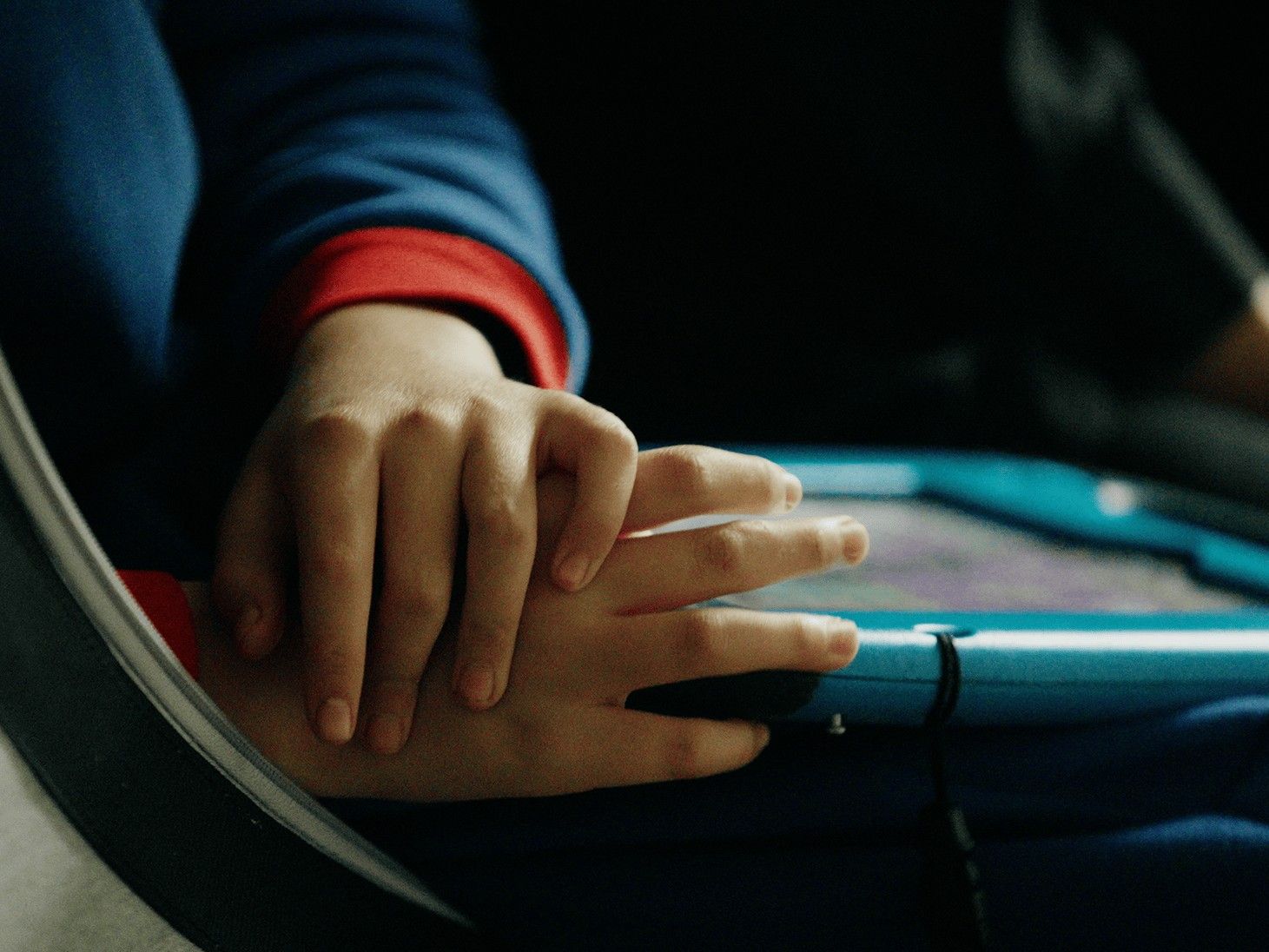 Boy touching his hand